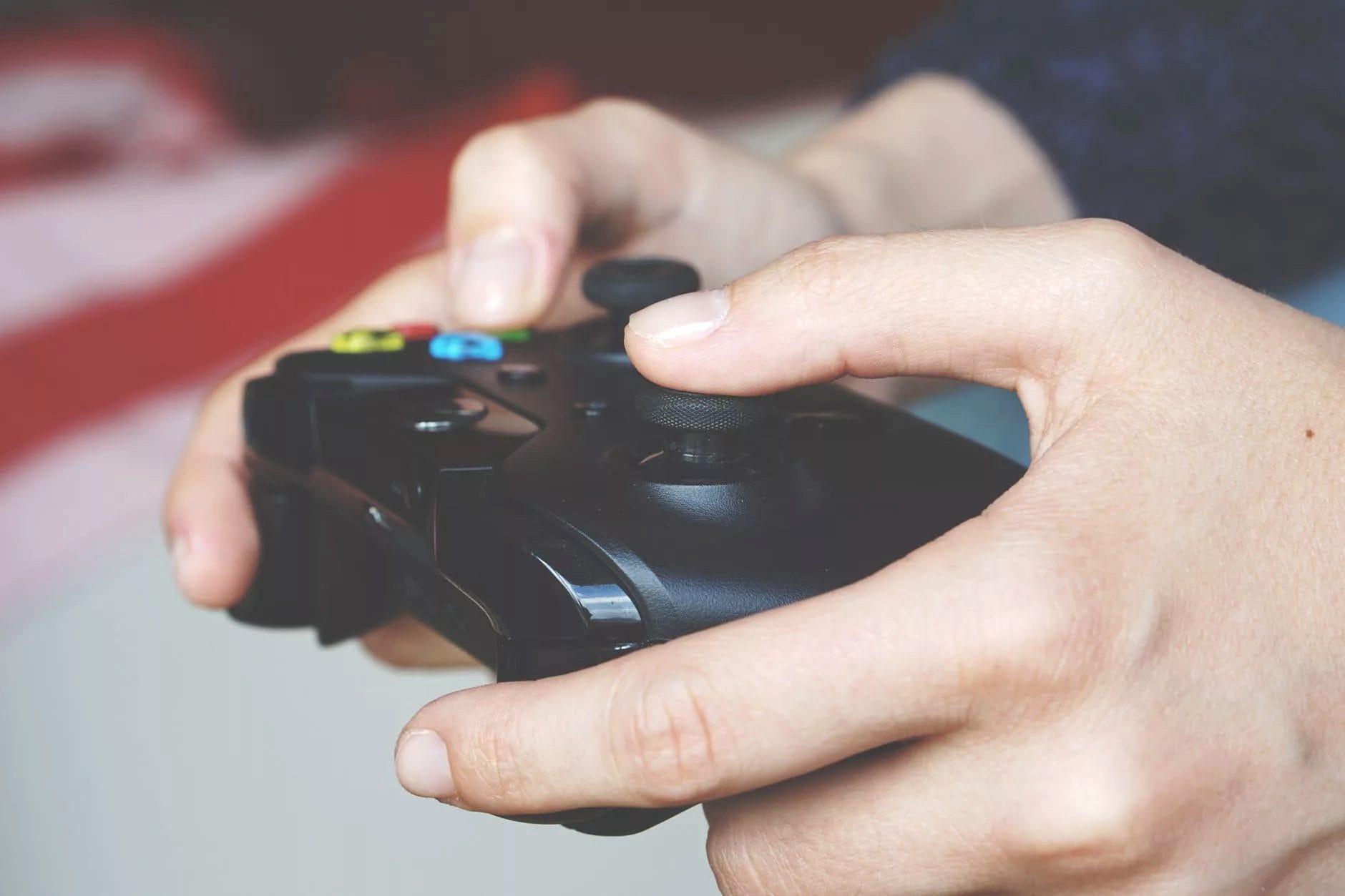 man holding black game controller