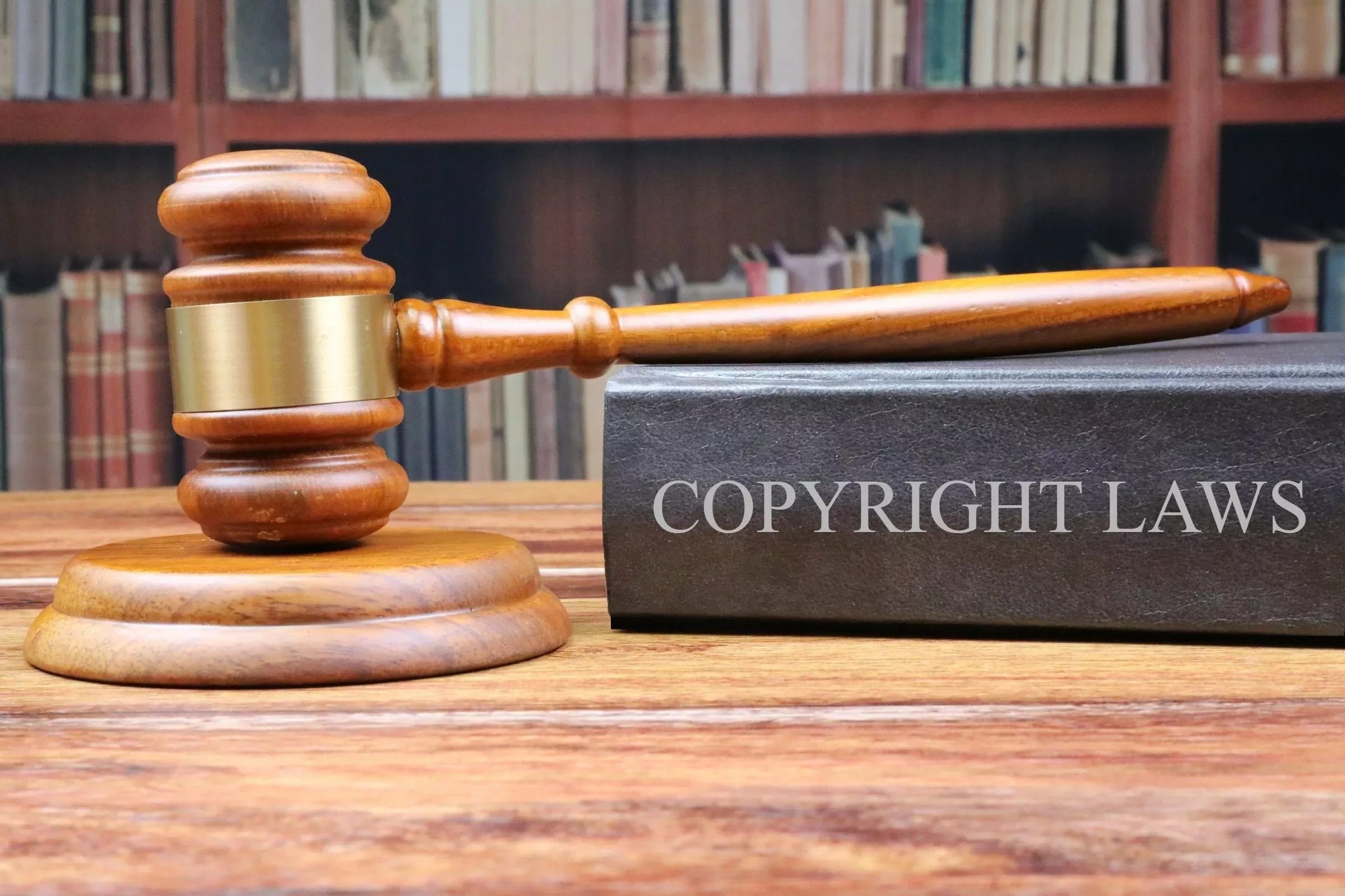 Intellectual Property Protection and Rights  in the Games Industry -What is Copyright Law - A judge gavel sits on top of a book on intellectual property rights in video game development.